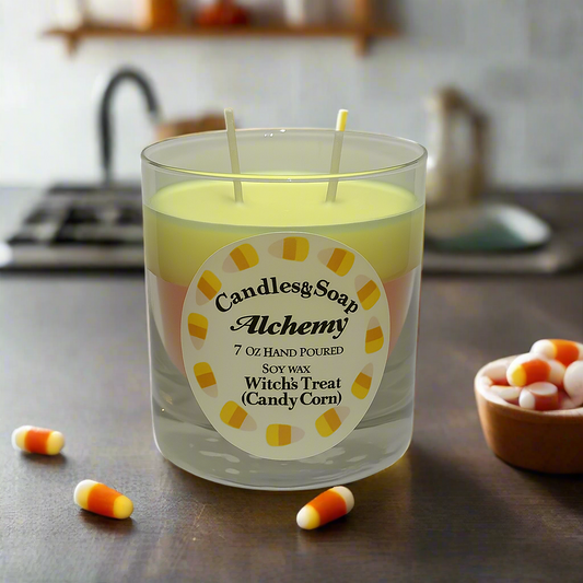 Candle in a glass container with a label on a white background