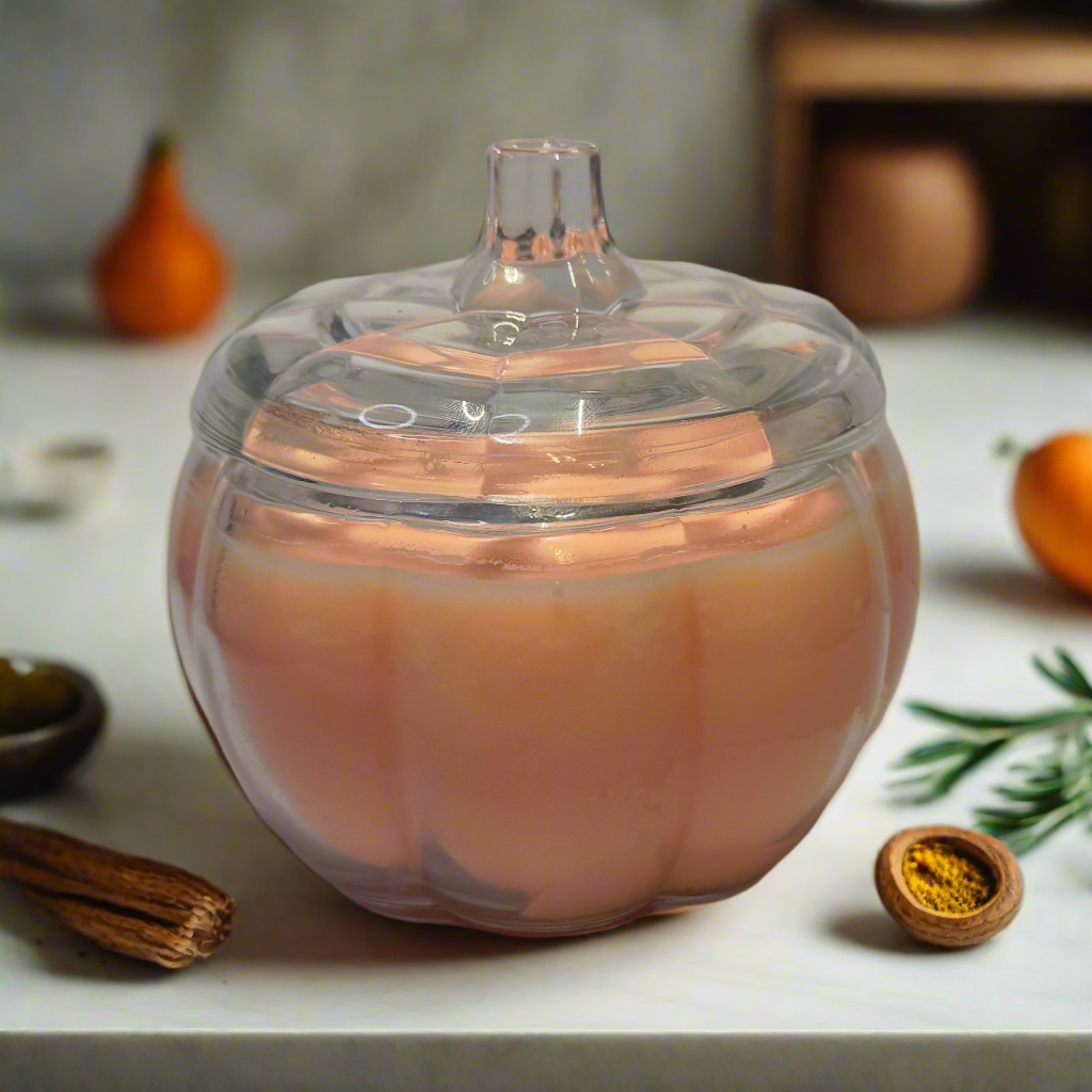 Pumpkin-shaped container with a clear lid on a white background