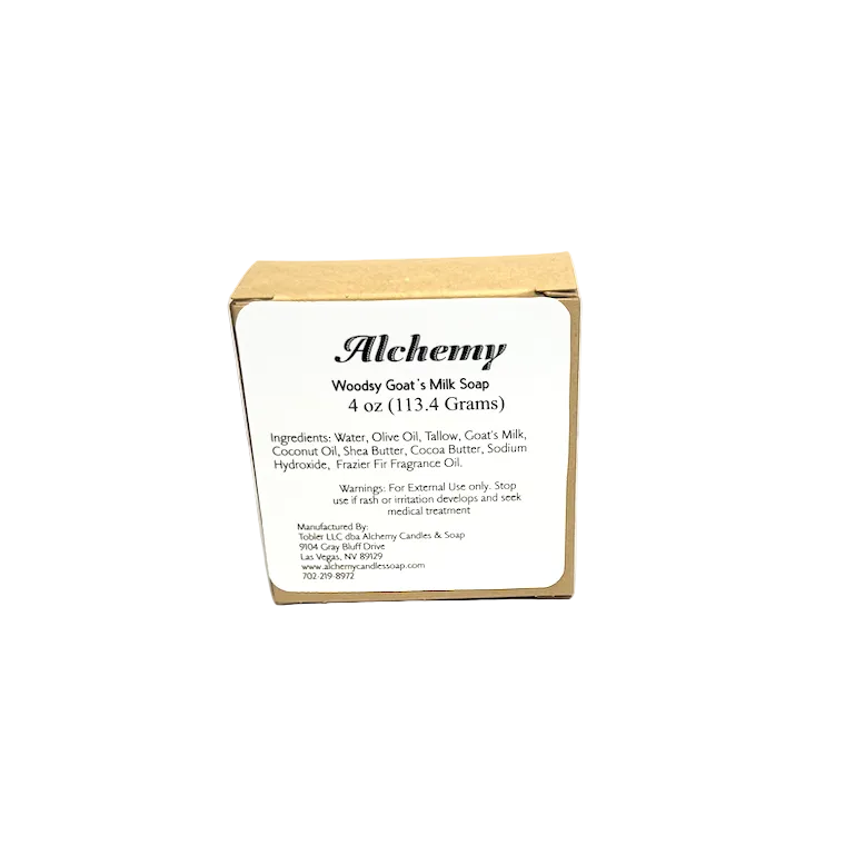 Box of Alchemy Woody Goat's Milk Soap on a gray background