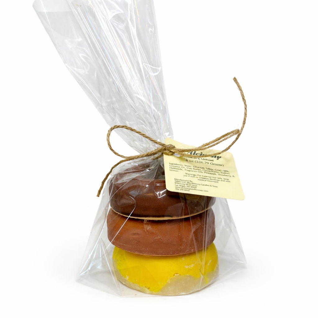 3 soaps that are shaped like donuts in clear packaging