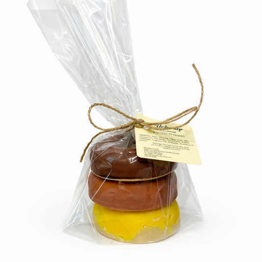 3 soaps that are shaped like donuts in clear packaging