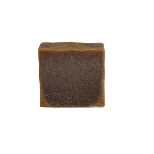 Square bar of soap with a textured surface on a white background