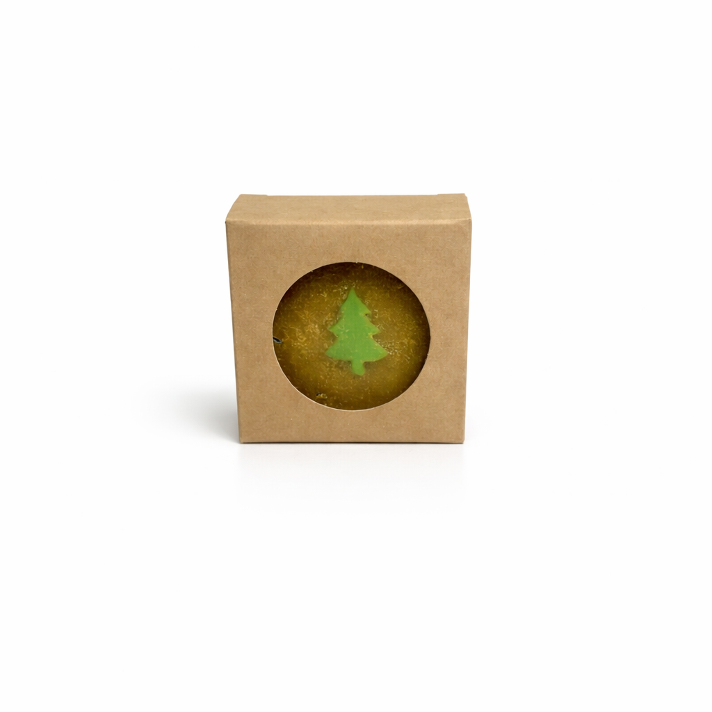 Small green tree-shaped object inside a brown cardboard box on a white background