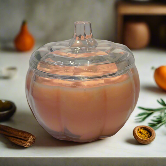 Pumpkin-shaped container with a clear lid on a white background