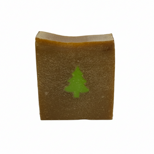 Bar of soap with a green tree design on a white background