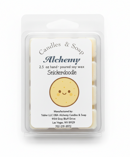 Wax melt package with 'Alchemy' branding and a smiley face design on a gray background