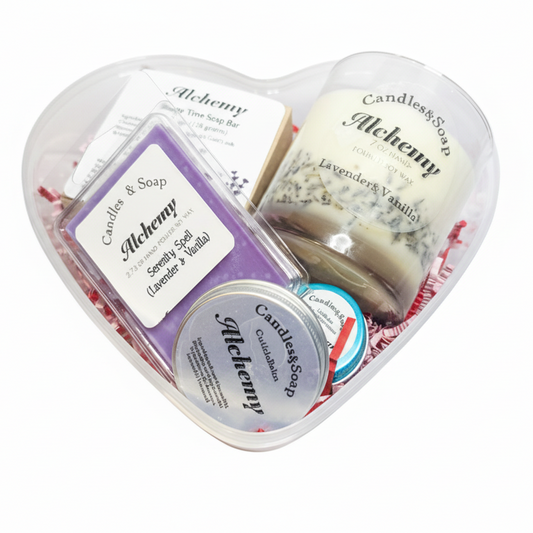 Heart-shaped container with candles and soap labeled 'Candles & Soap Alchemy' on a white background