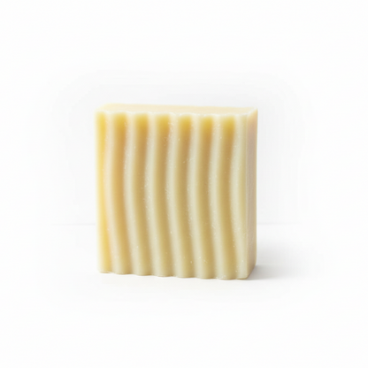 Rectangular bar of soap with wavy texture on a white background