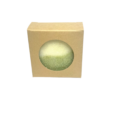 Beige box with a round green object inside on a gray background