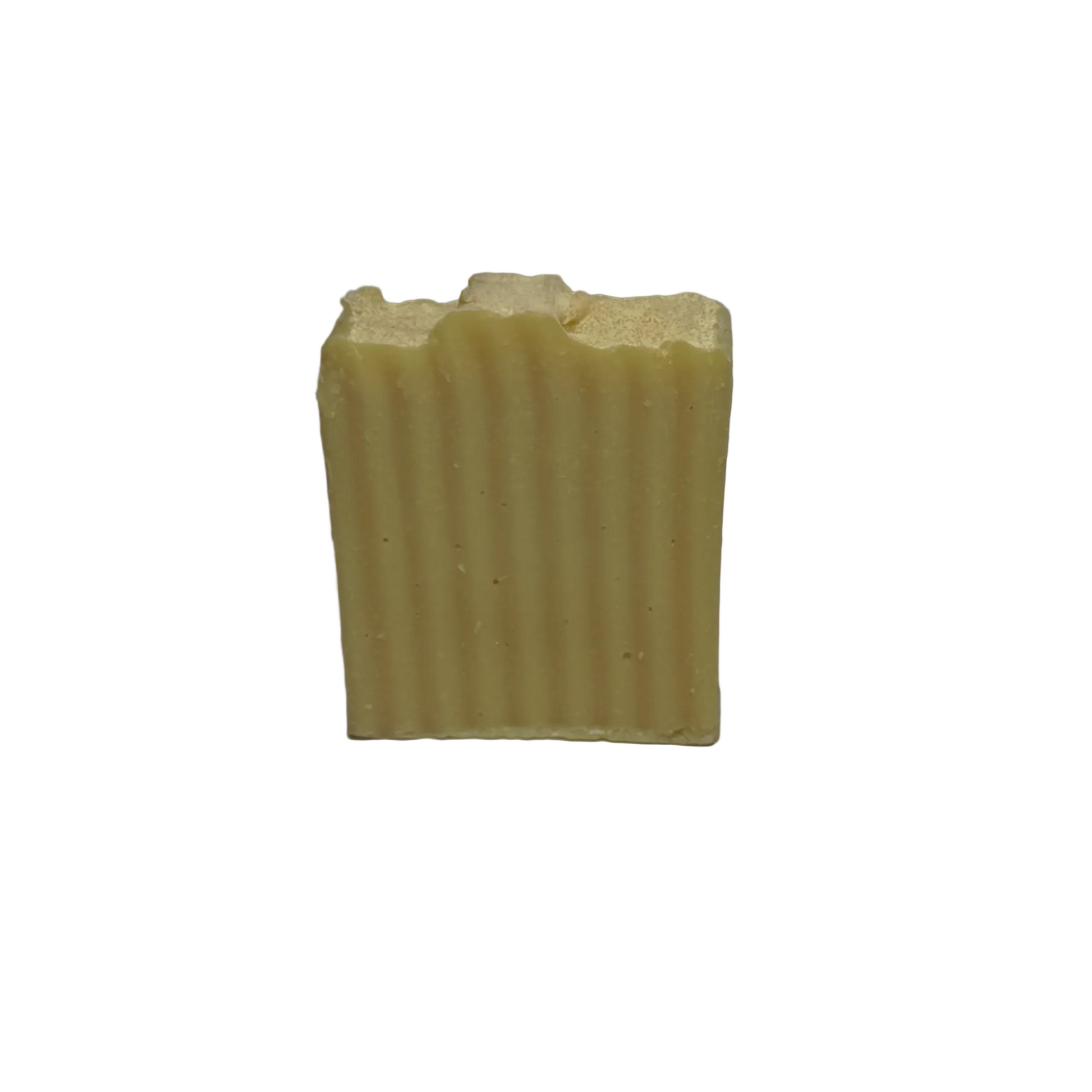 Bar of soap with a ribbed texture on a white background