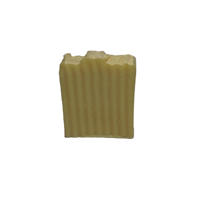 Bar of soap with a ribbed texture on a white background