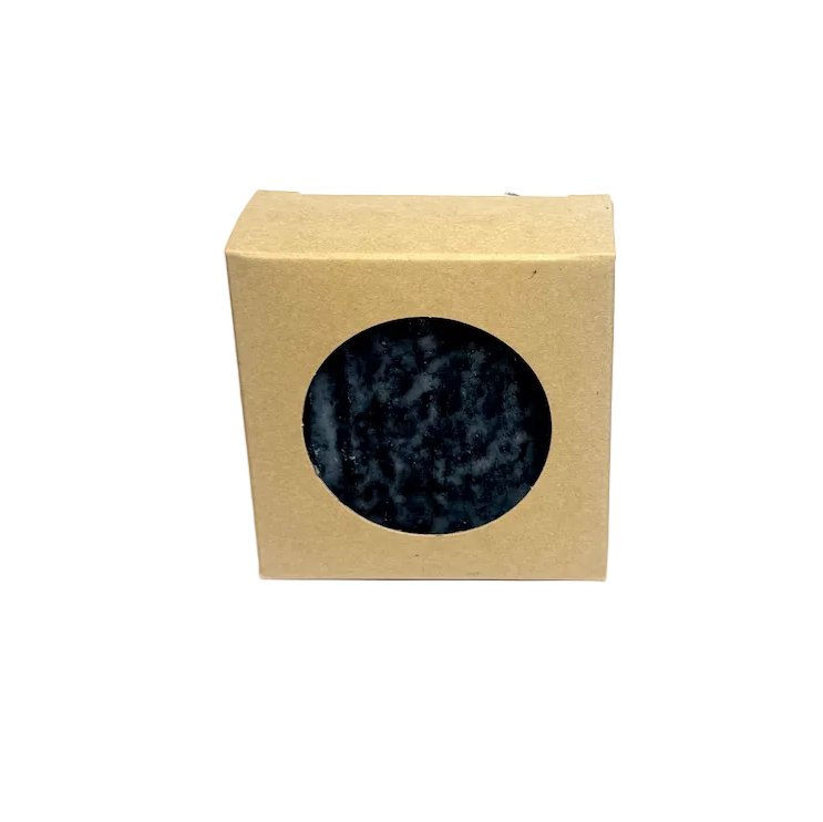 Beige box with a circular window displaying a speckled blue and gray pattern on a white background