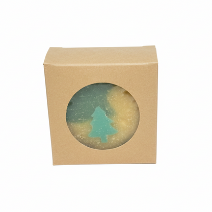 Beige box with a circular window displaying a blue tree silhouette on a gray background